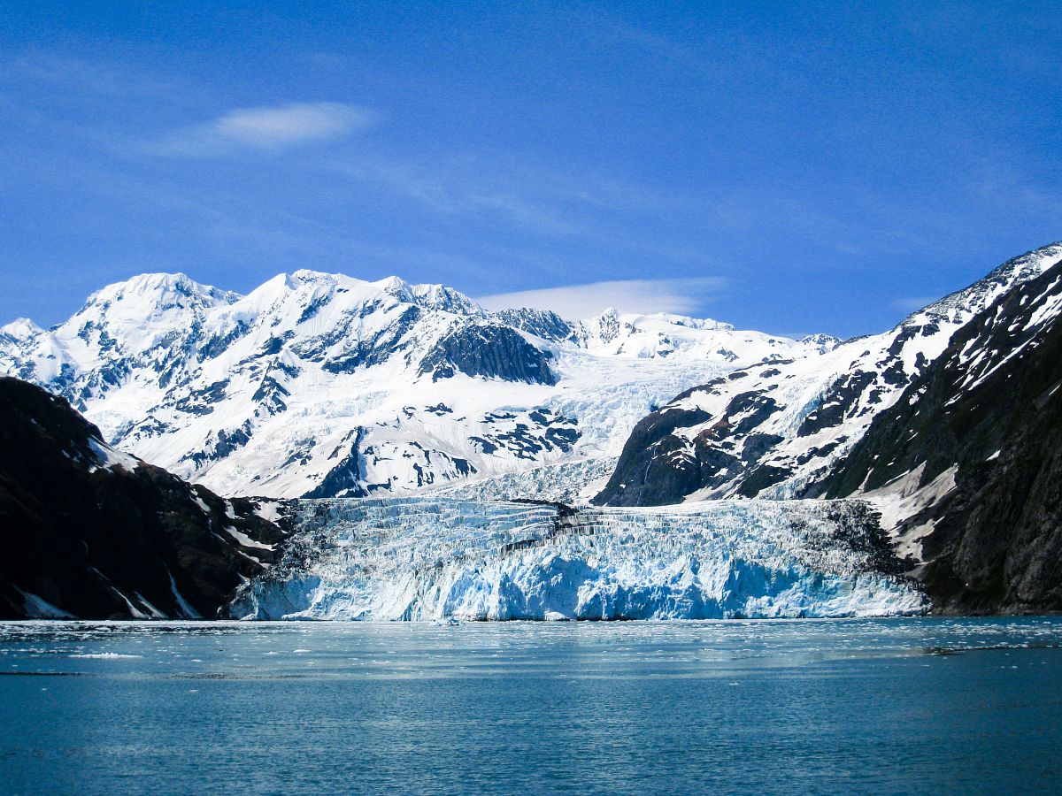 Glacier-fed waters of Harriman Fjord, Alaska, surrounded by snow-capped mountains
